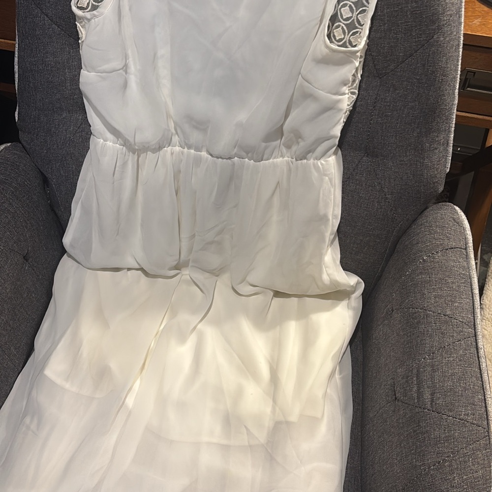 Elegant White Sleeveless Dress with Embellished Shoulders
